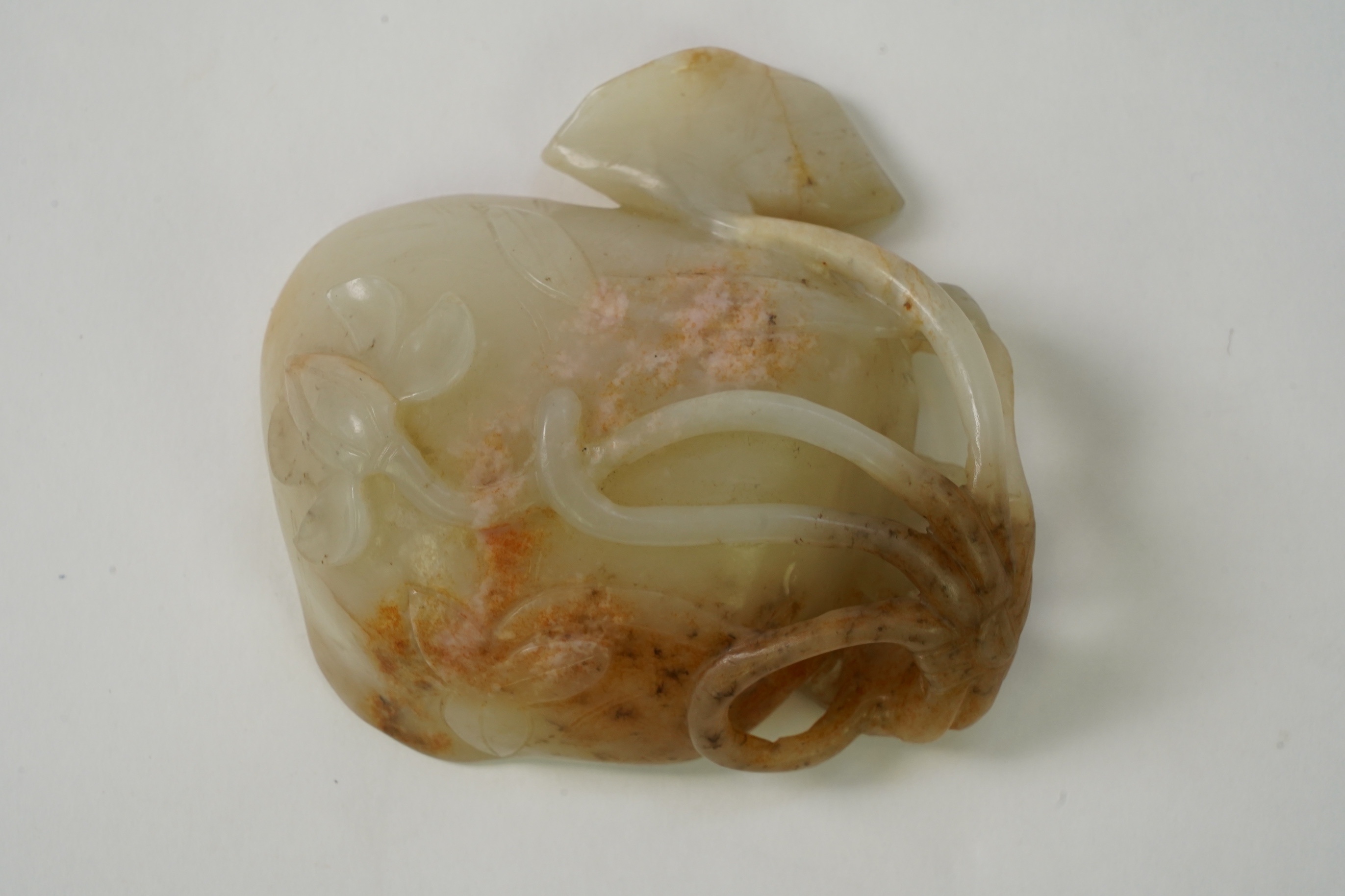 A Chinese pale celadon and russet jade brushwasher, Ming dynasty, 16th/17th century